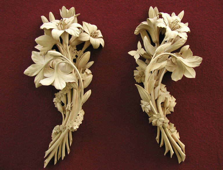 photo of two vertical flower arrangements